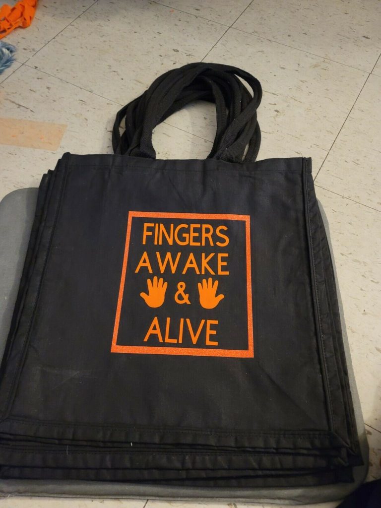 A photo of the FINGERS AWAKE AND ALIVE tote bag